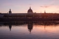 Hotel Dieu in Lyon, France, taken from the Rhone riverbank during an evening sunset. Royalty Free Stock Photo