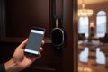 Hotel door security unlocking by application on mobile phone Royalty Free Stock Photo