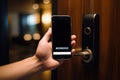 Hotel door security unlocking by application on mobile phone Royalty Free Stock Photo