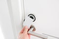 Hotel door - Young man holding a keycard in front of the electronic sensor of a room door. Concept travel or business Royalty Free Stock Photo