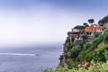 Hotel on the edge of the mountain, with a view to the sea Rain clouds over beautiful Sorrento, Meta Bay in Italy, travel and