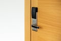 Hotel electronic lock on wooden door Royalty Free Stock Photo