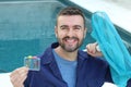 Hotel employee cleaning swimming pool