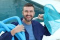 Hotel employee cleaning swimming pool Royalty Free Stock Photo