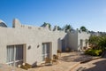 Hotel facade in Egypt With palm trees and green bushes Royalty Free Stock Photo