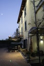 Hotel facade La Quercia, with moon at early morning blue sky
