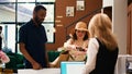 Hotel guests showing passports Royalty Free Stock Photo