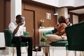 Hotel guests sitting in lounge area