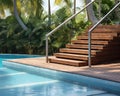 The hotel has a swimming pool with str and wooden deck. Royalty Free Stock Photo