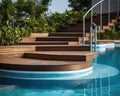 The hotel has a swimming pool with str and wooden deck. Royalty Free Stock Photo
