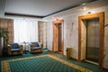 Hotel interior. Furniture and elevators in the hallway