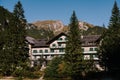 Hotel on Lake Braies, in the Dolomites, among the green forest and mountains. Royalty Free Stock Photo