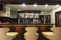 Hotel lounge bar with bottle shelfs and seats Royalty Free Stock Photo