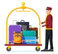 Hotel Luggage Cart Full of Luggage and Bellhop