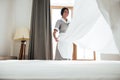 Hotel maid changing bed sheet Royalty Free Stock Photo