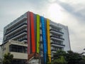 a hotel with the main color of the exterior walls being black and white and parts of the walls being red, green, blue and orange