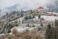 Hotel in mountains. Snow and fog.Winter coming Royalty Free Stock Photo