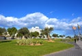 Hotel Neptuno in Playa de Valencia beach. City street in Spain, road traffic, cars, people and buildings.