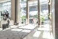 Hotel or office building lobby blur background interior view toward reception hall, modern luxury white room space Royalty Free Stock Photo