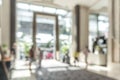 Hotel or office building lobby blur background interior view toward reception hall, modern luxury white room space Royalty Free Stock Photo