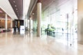 Hotel or office building lobby blur background interior view toward reception hall, modern luxury white room space Royalty Free Stock Photo