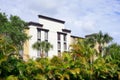 A hotel and palm trees Royalty Free Stock Photo