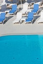 Hotel Poolside Chairs near a swimming pool Royalty Free Stock Photo