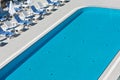 Hotel Poolside Chairs near a swimming pool Royalty Free Stock Photo