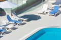 Hotel Poolside Chairs near a swimming pool Royalty Free Stock Photo