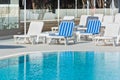 Hotel Poolside Chairs near a swimming pool Royalty Free Stock Photo