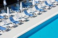 Hotel Poolside Chairs near a swimming pool Royalty Free Stock Photo