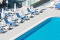 Hotel Poolside Chairs near a swimming pool Royalty Free Stock Photo