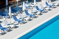 Hotel Poolside Chairs near a swimming pool Royalty Free Stock Photo