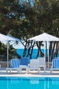 Hotel Poolside Chairs with Sea view Royalty Free Stock Photo