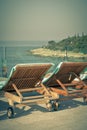 Hotel Poolside Chairs with Sea view. Royalty Free Stock Photo