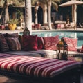 Hotel poolside lounge are with sofa with oriental Arabic ornaments fringed pillows and plaid. Beautiful eastern spa