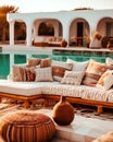 Hotel poolside lounge are with sofa with oriental arabic or turkish ornaments fringed pillows. Beautiful eastern spa or wellness