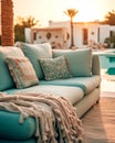 Hotel poolside lounge are with sofa with oriental arabic ornaments fringed pillows and plaid. Beautiful eastern spa or wellness