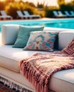 Hotel poolside lounge are with sofa with oriental arabic or turkish ornaments pillows and plaid. Beautiful eastern spa or wellness Royalty Free Stock Photo