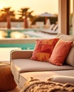 Hotel poolside lounge are with sofa with ornaments fringed pillows. Beautiful spa or wellness concept, recreational vacation