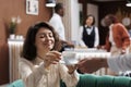 Hotel porter serving woman with coffee