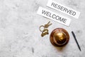 Hotel reception desk with booking form stone background top view mock-up Royalty Free Stock Photo