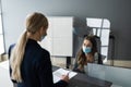 Hotel Reception Desk Protected By Medical Mask Royalty Free Stock Photo