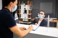 Hotel Reception Desk Protected By Medical Mask Royalty Free Stock Photo
