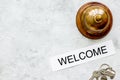 Hotel reception desk with ring and keys stone table background t