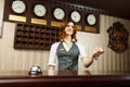 Hotel receptionist at counter desk with keys Royalty Free Stock Photo