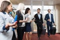 Hotel Receptionist Meeting Business People Group In Lobby Royalty Free Stock Photo