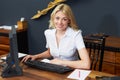 Hotel Receptionist Using Computer And Phone Royalty Free Stock Photo
