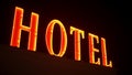 Hotel, red neon sign on the building illuminated at night Royalty Free Stock Photo