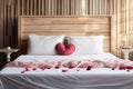 Hotel romance Bed adorned with rose petals creating a romantic setting